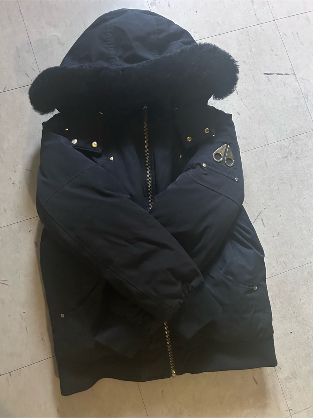 Moose Knuckles Black Quilted Jacket Interior with Gold Logo